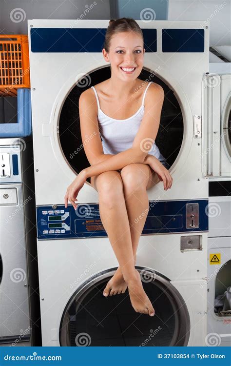 woman sitting on washing machine|left clothes in washer.